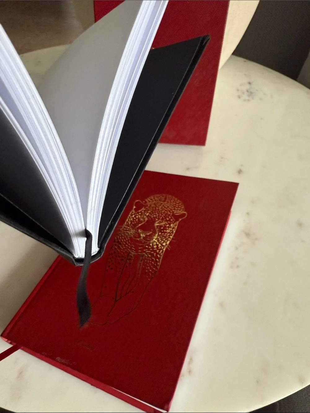 Cartier Red and Black Hardcover Notebooks with Gold Accents